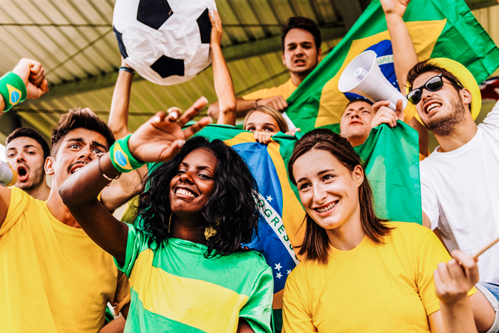 soccer fans wearing Brazilian colors