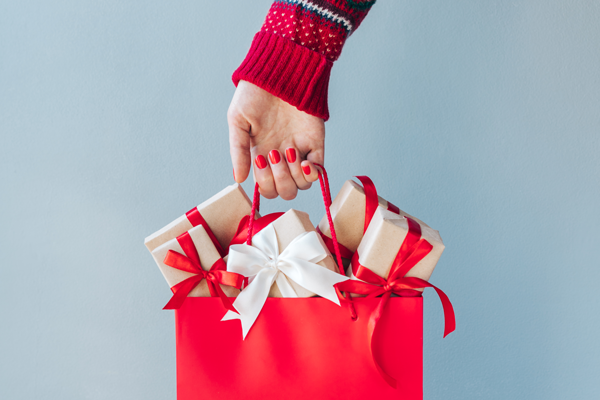 hand holding a bag of gifts