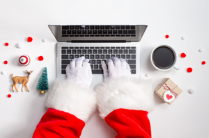 santa typing on a laptop